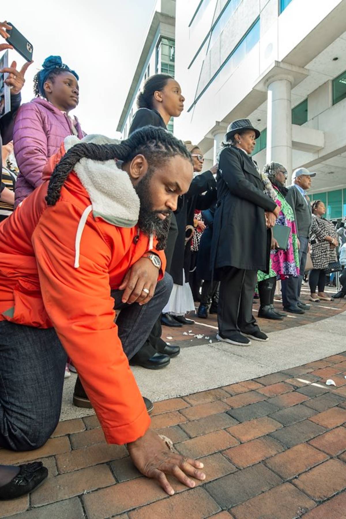 man kneeling in remembrance