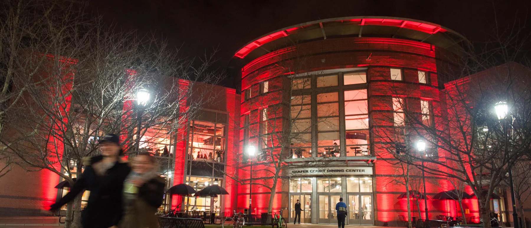 v.c.u. shafer court dining center at night lit up by a red light in celebration of chinese new years
