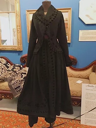 Meriva Carpenter dress reform garment - black dress with bloomer pants showing at bottom (possibly an example of the American Costume)  Cortland County Historical Society, Homer, New York