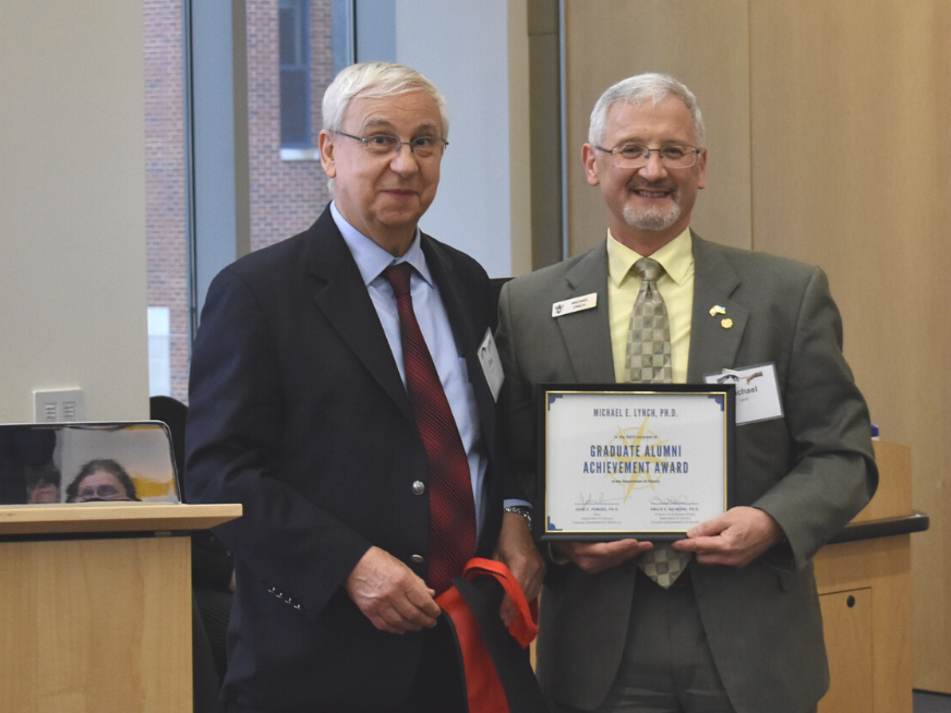 joe bendersky and michael lynch posing with award